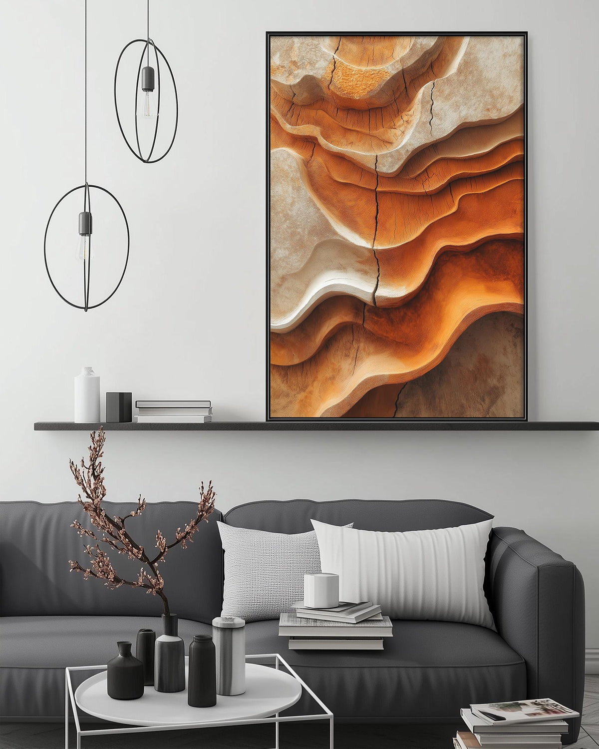 a modern living room with a gray sofa, a coffee table, and a large abstract painting hanging on the wall above the sofa.