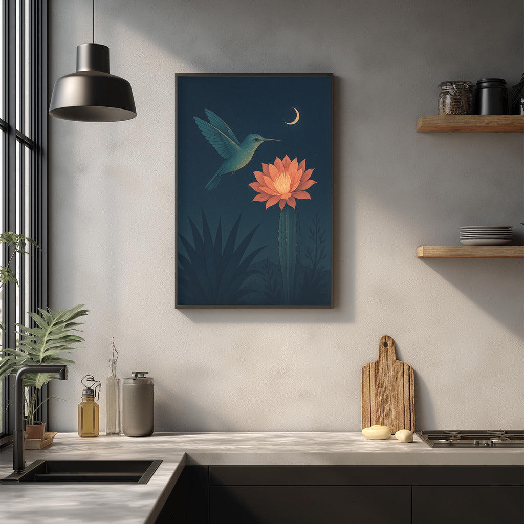 a kitchen counter with various items, including a wooden cutting board, a cactus plant, and a framed illustration of a hummingbird flying over a flower.