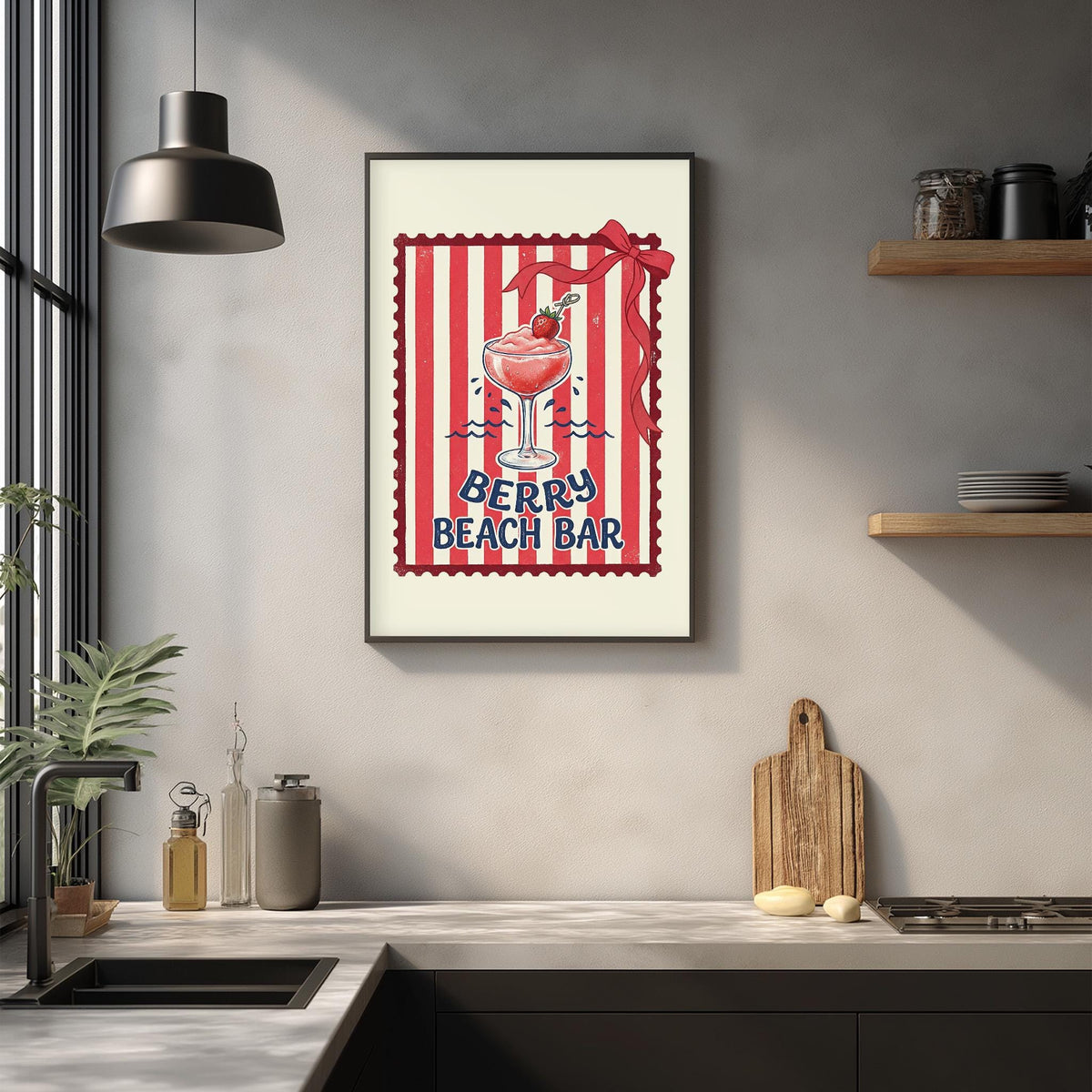 a framed poster of a red and white striped design with a glass of berry-flavored beverage, hanging on a wall above a kitchen counter.