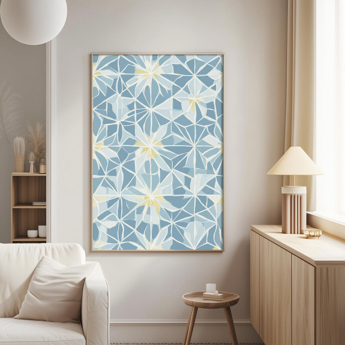 a living room with a white sofa, a wooden side table, and a framed artwork with a blue and white geometric pattern hanging on the wall.