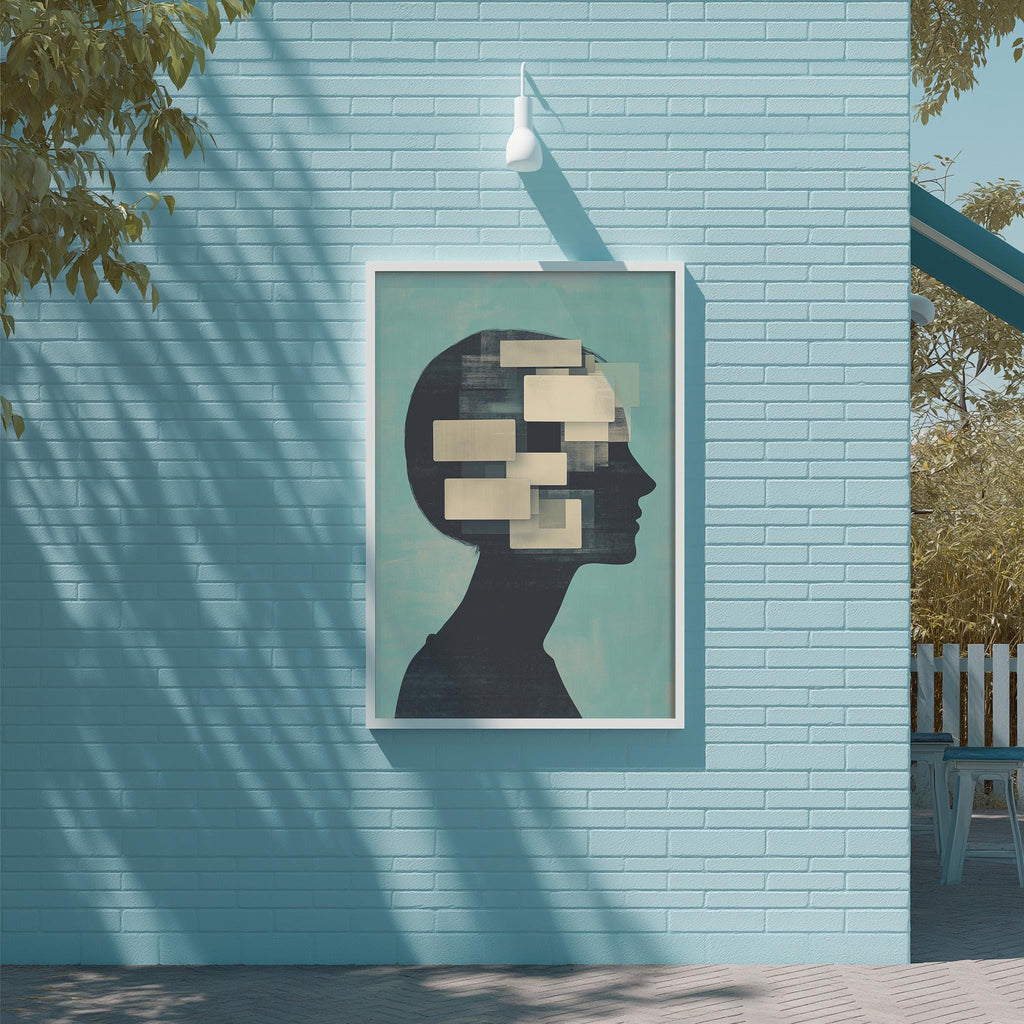 a blue brick wall with a framed artwork depicting a silhouette of a person's head with abstract shapes inside it.