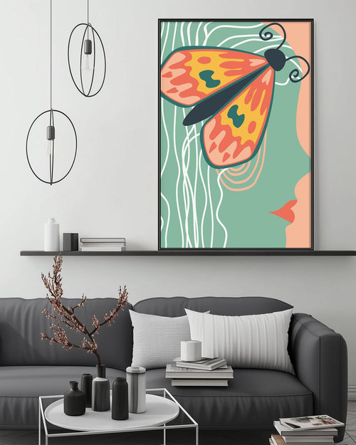 a modern living room with a gray sofa, a coffee table, and a large abstract painting of a butterfly on the wall.