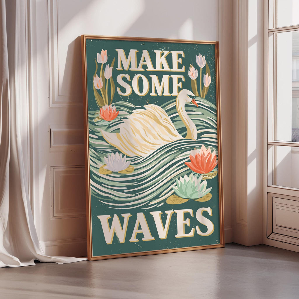 A framed poster with a swan and flowers, along with the text "MAKE SOME WAVE" displayed on it.