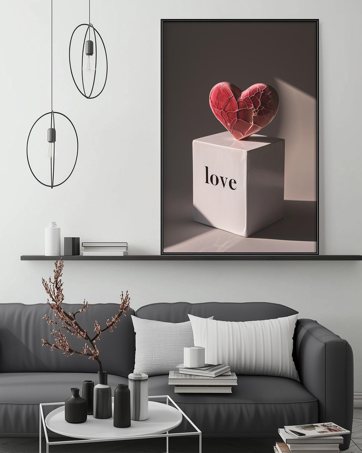 a modern living room with a gray sofa, a coffee table, and a large framed artwork depicting a heart-shaped object with the word "love" written on it.