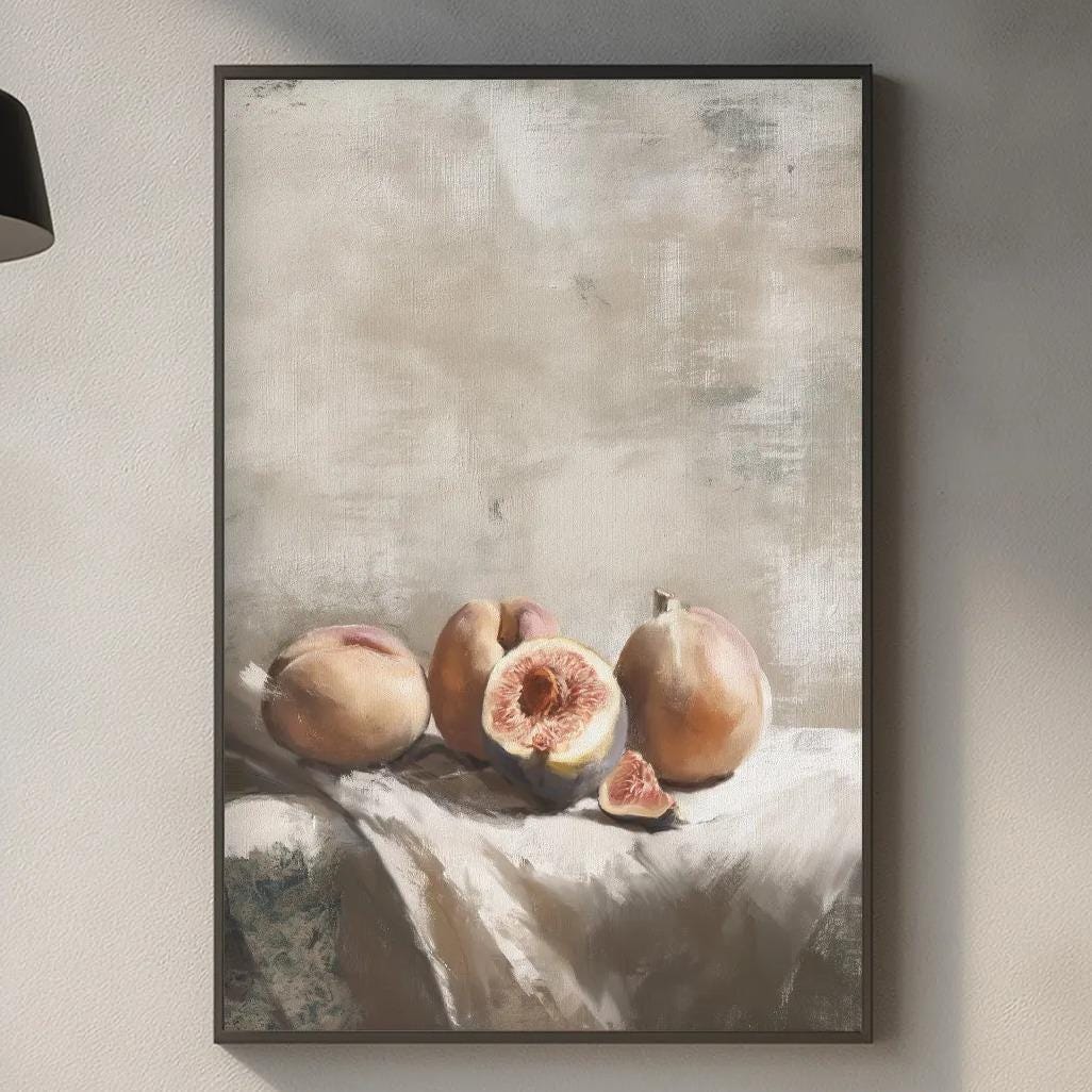 a kitchen counter with a framed painting of fruit, including peaches and a wooden cutting board, as well as various kitchen items such as a potted plant, a vase, and a bottle.