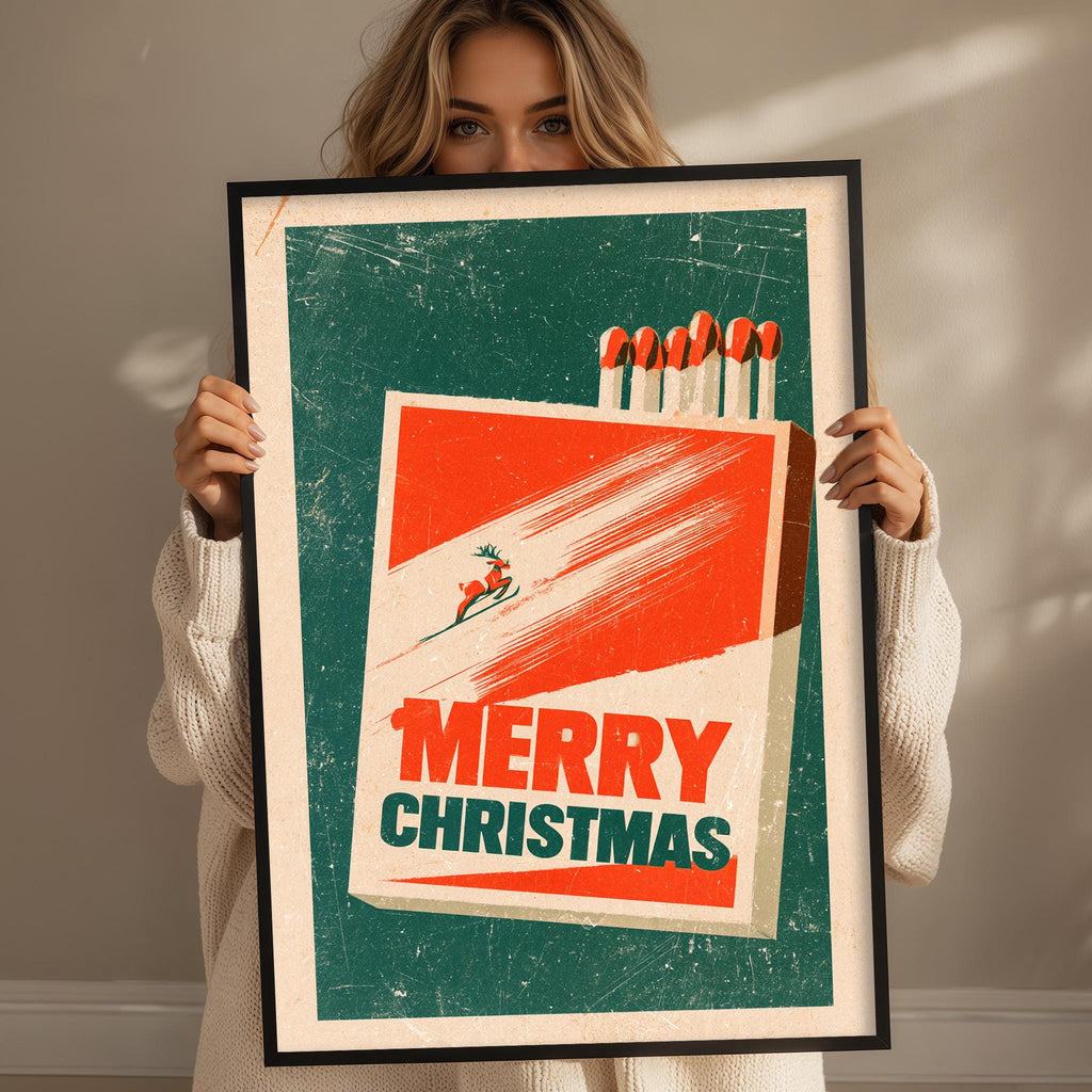 A woman is holding up a framed poster with a Christmas-themed design.