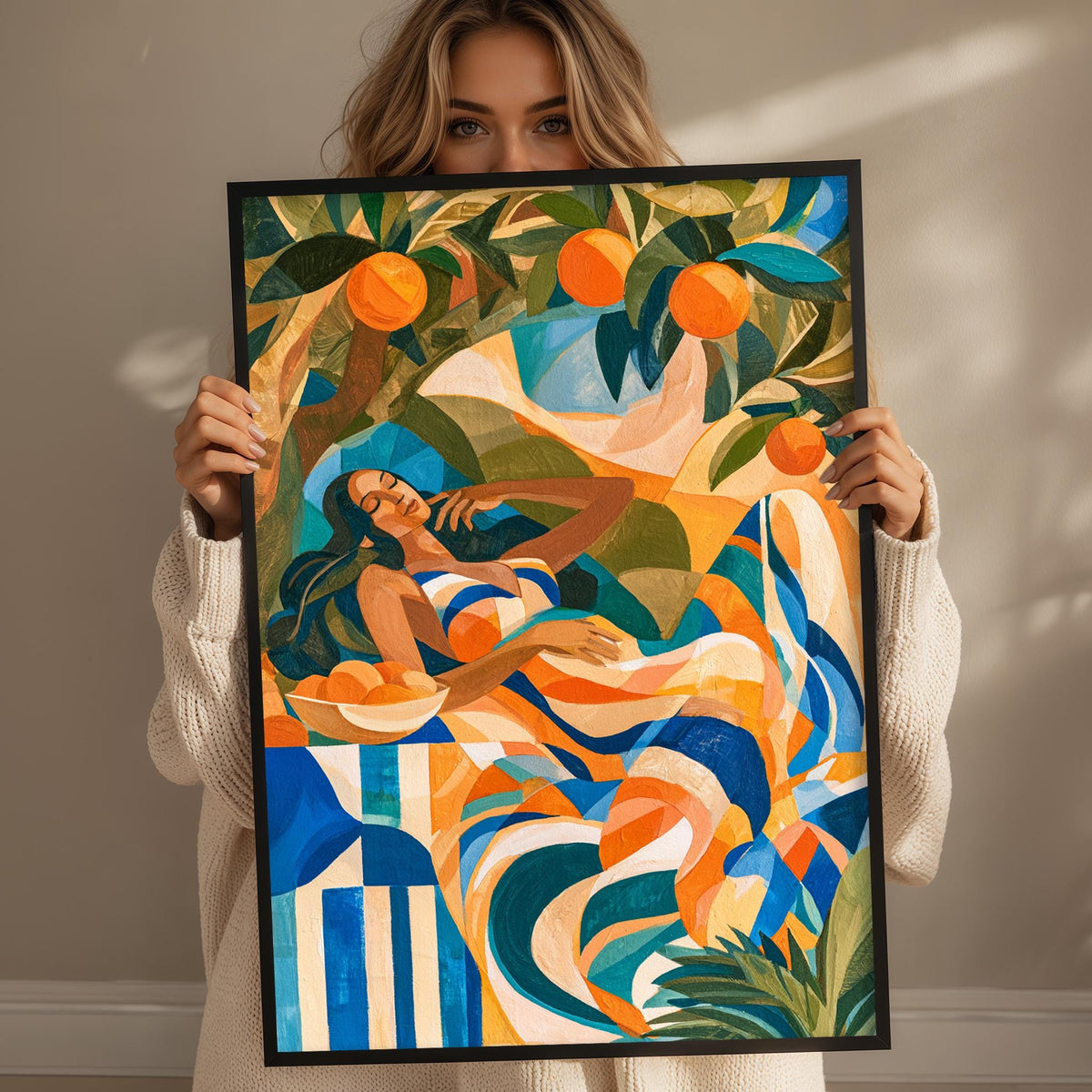 A woman holds up a framed painting depicting a vibrant, abstract scene with a woman lying in a hammock surrounded by a colorful, tropical landscape.