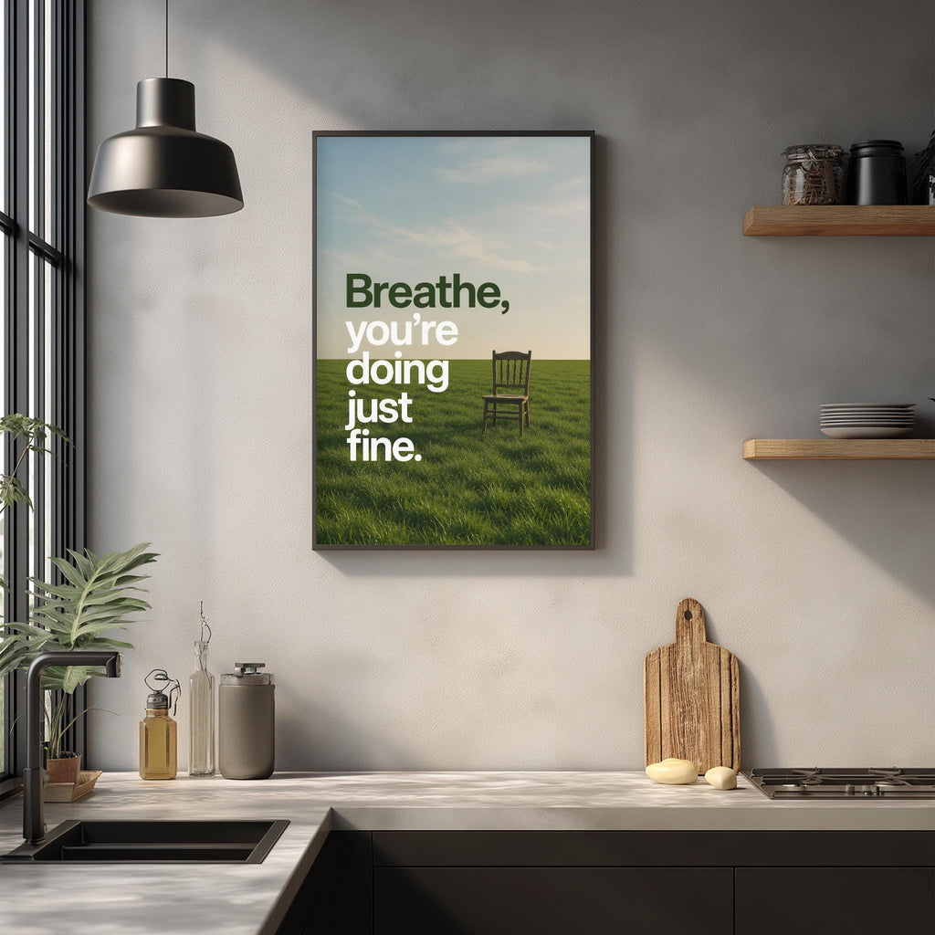 a kitchen counter with a framed poster above it that reads "Breathe, you're doing just fine."