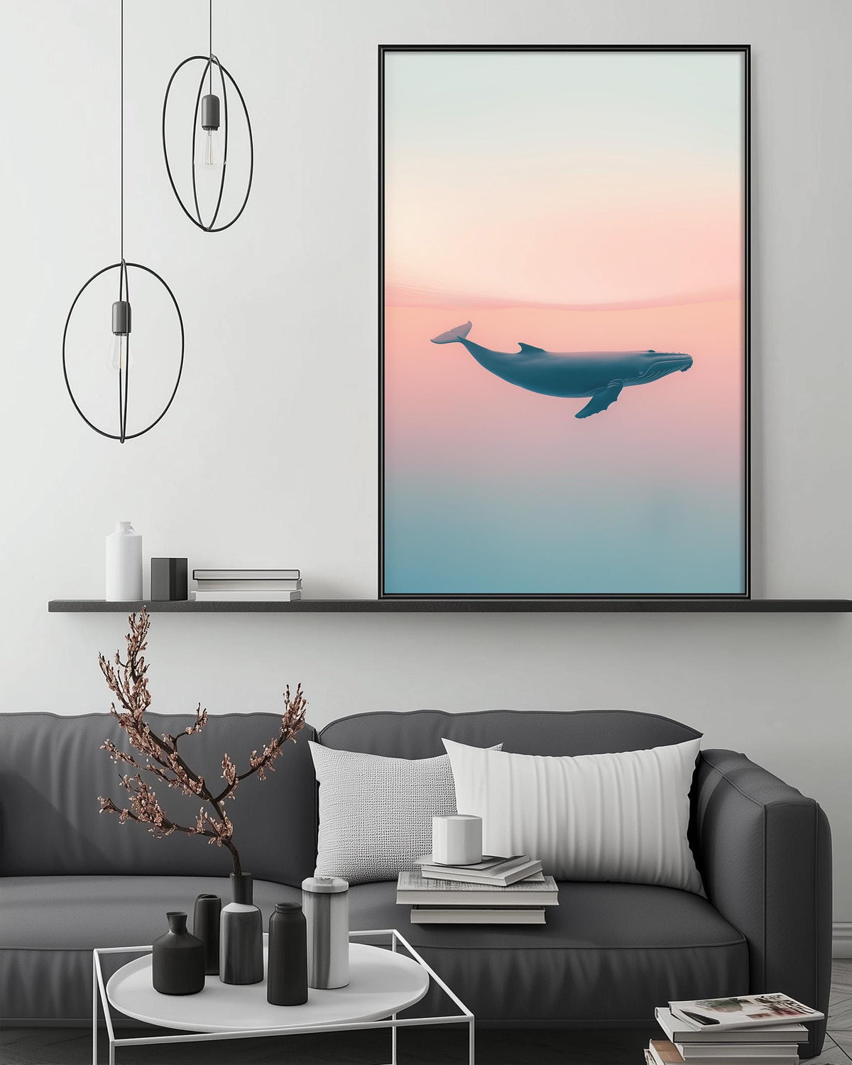 a large framed picture of a whale on a wall above a gray couch with a coffee table in front of it. The room has a minimalist and modern design, with a shelf displaying decorative items and a pendant light hanging above the couch.