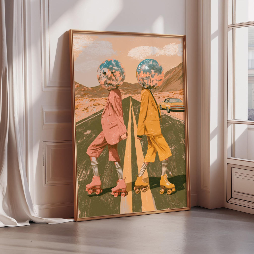 The image is a framed artwork depicting two people on rollerblades, each with a head wearing a different color, against a backdrop of a desert landscape with mountains.