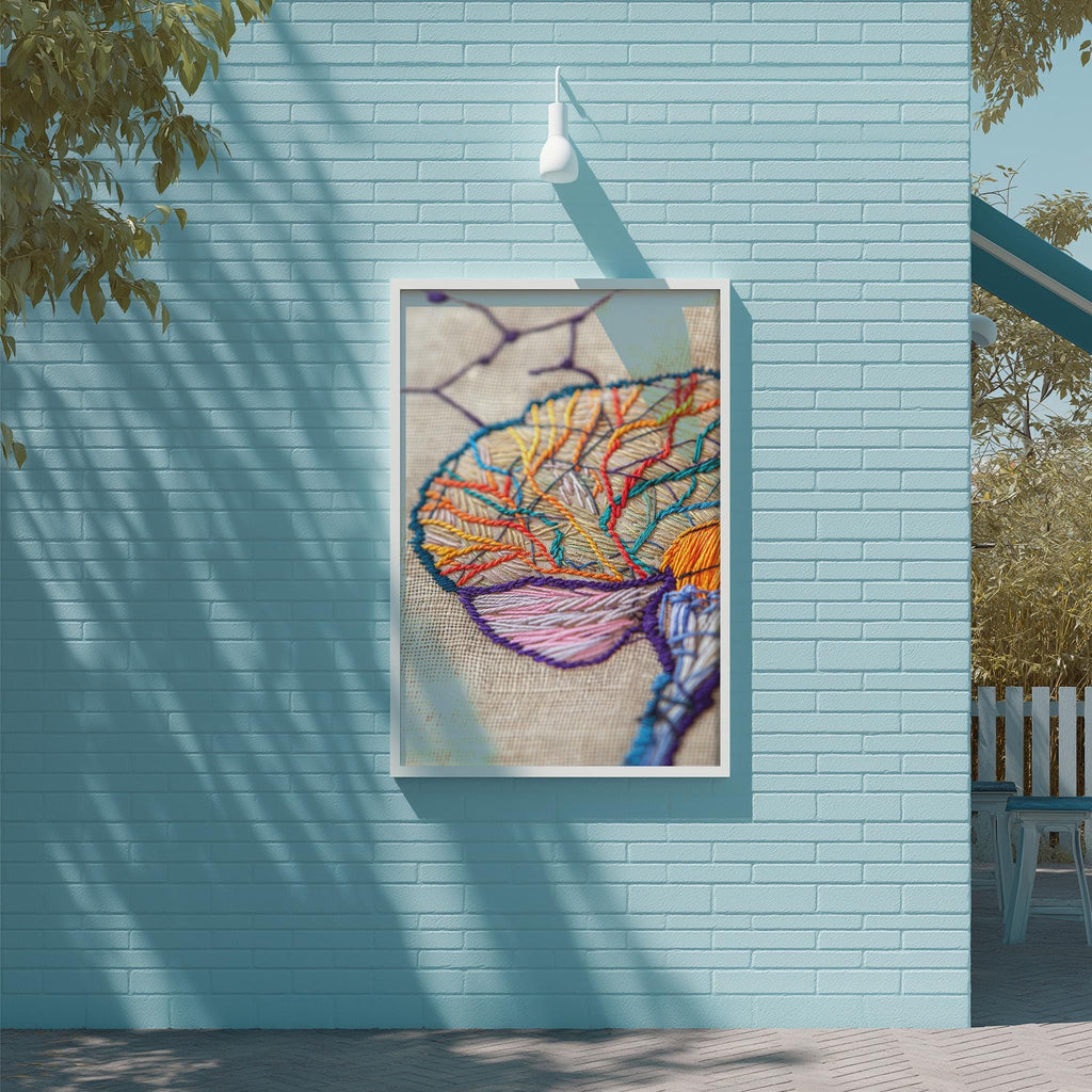 a vibrant, colorful embroidered piece hanging on a light blue brick wall.