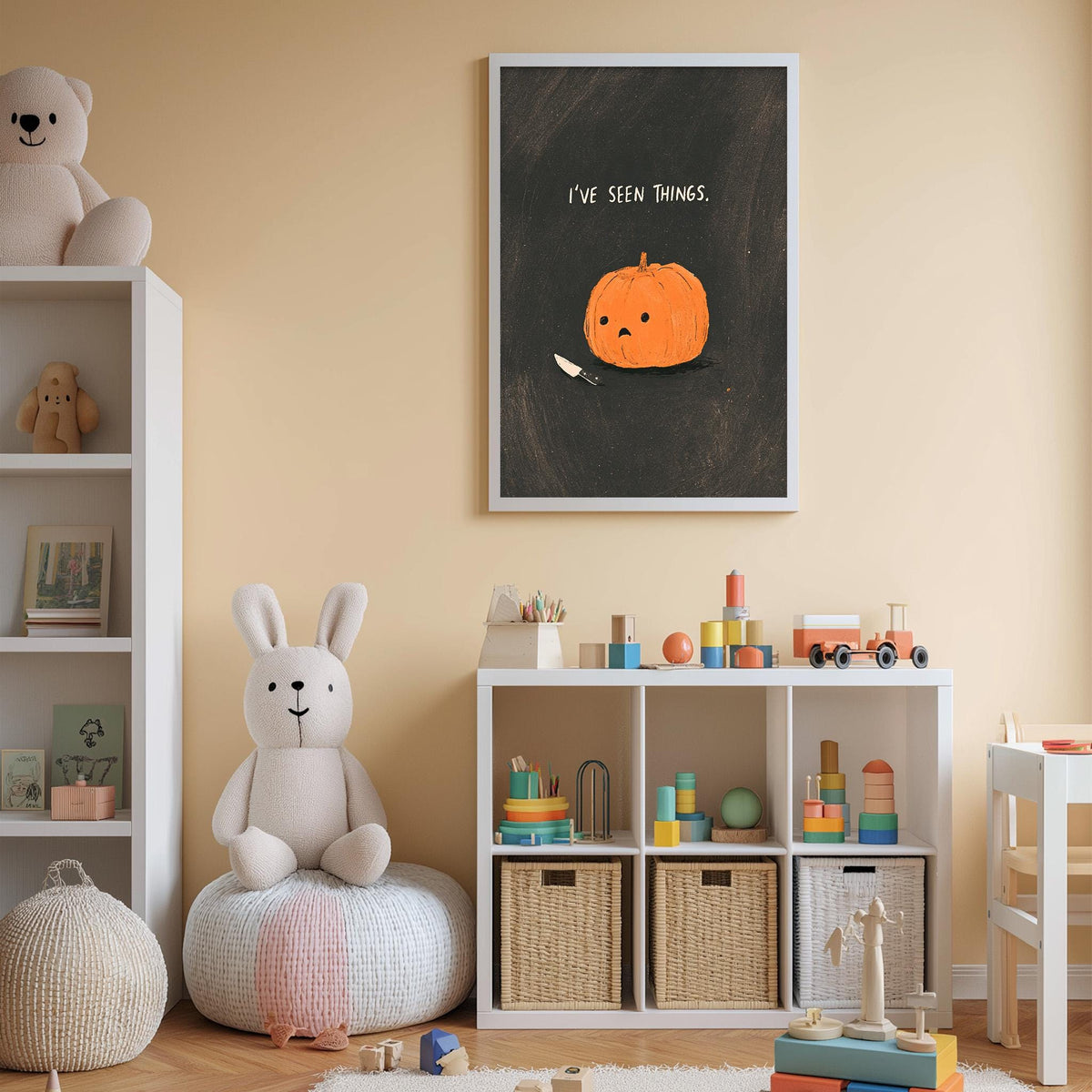 A cozy children's room with a white bookshelf, a plush rabbit, a pumpkin, and a framed poster with a cartoon pumpkin.