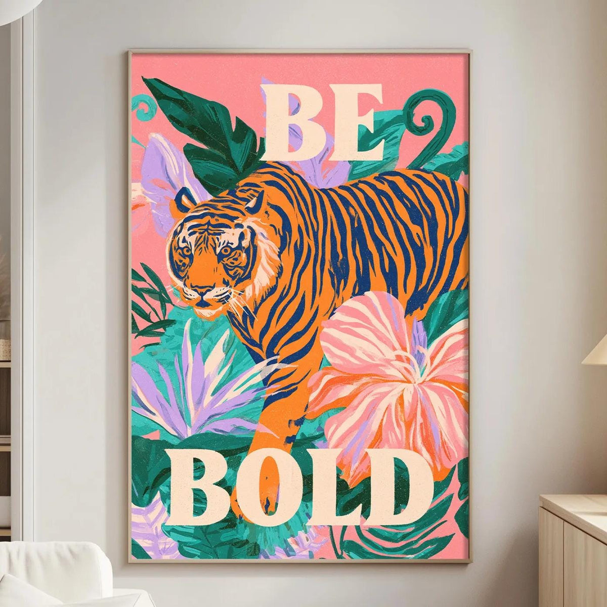 a vibrant poster with a tiger and tropical flowers, hanging on a wall in a living room.