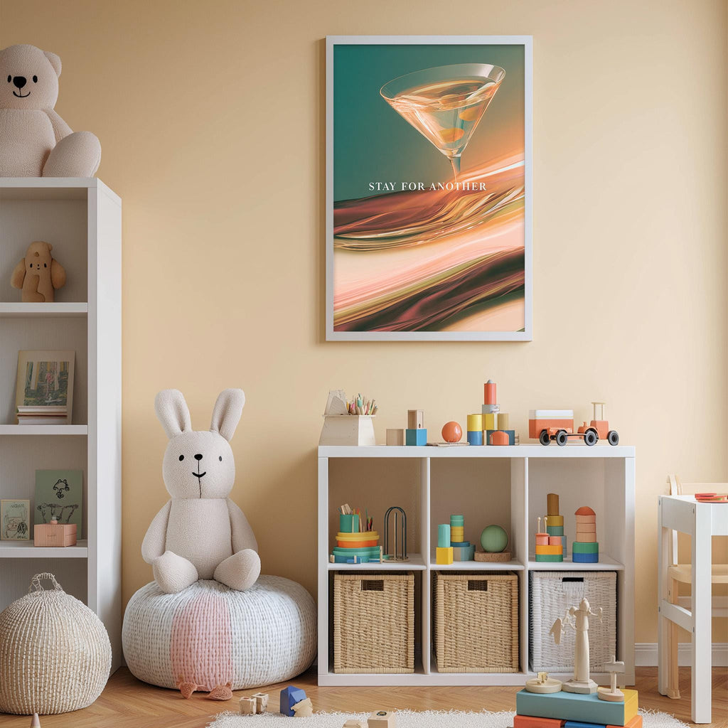 A child's bedroom with a white bookshelf, a stuffed rabbit, and a colorful toy box filled with toys. Above the bookshelf is a framed poster with a cocktail glass and the text "STAY FOR ANYTIME".