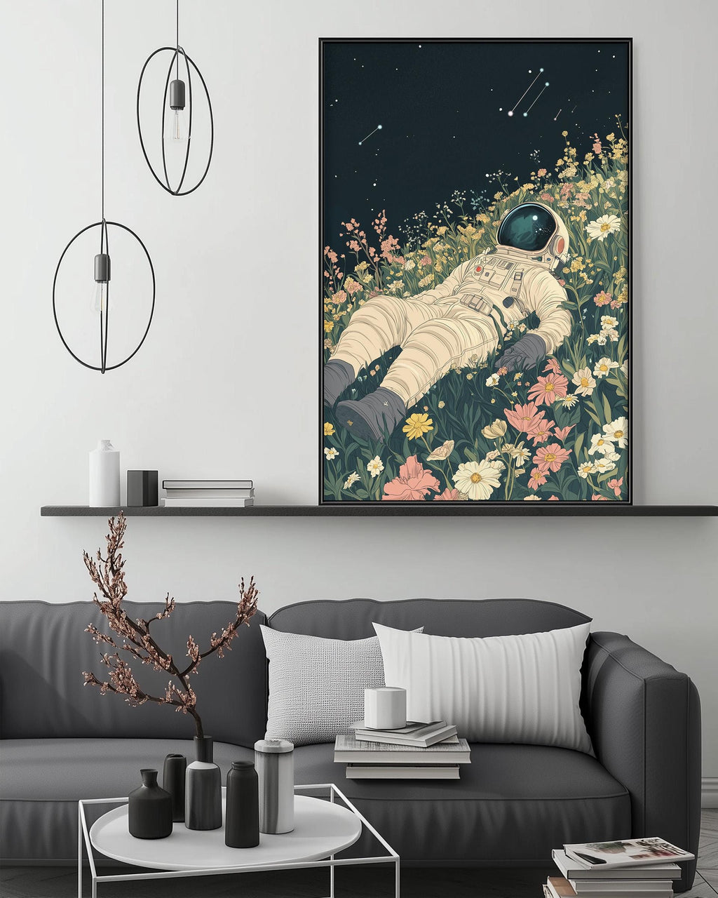 a large, colorful painting of an astronaut floating in a field of flowers, with a black background and a starry night sky. The painting is hanging on a wall above a gray couch, which has a coffee table in front of it. The room also has a shelf with various decorative items, and a potted plant on the floor.