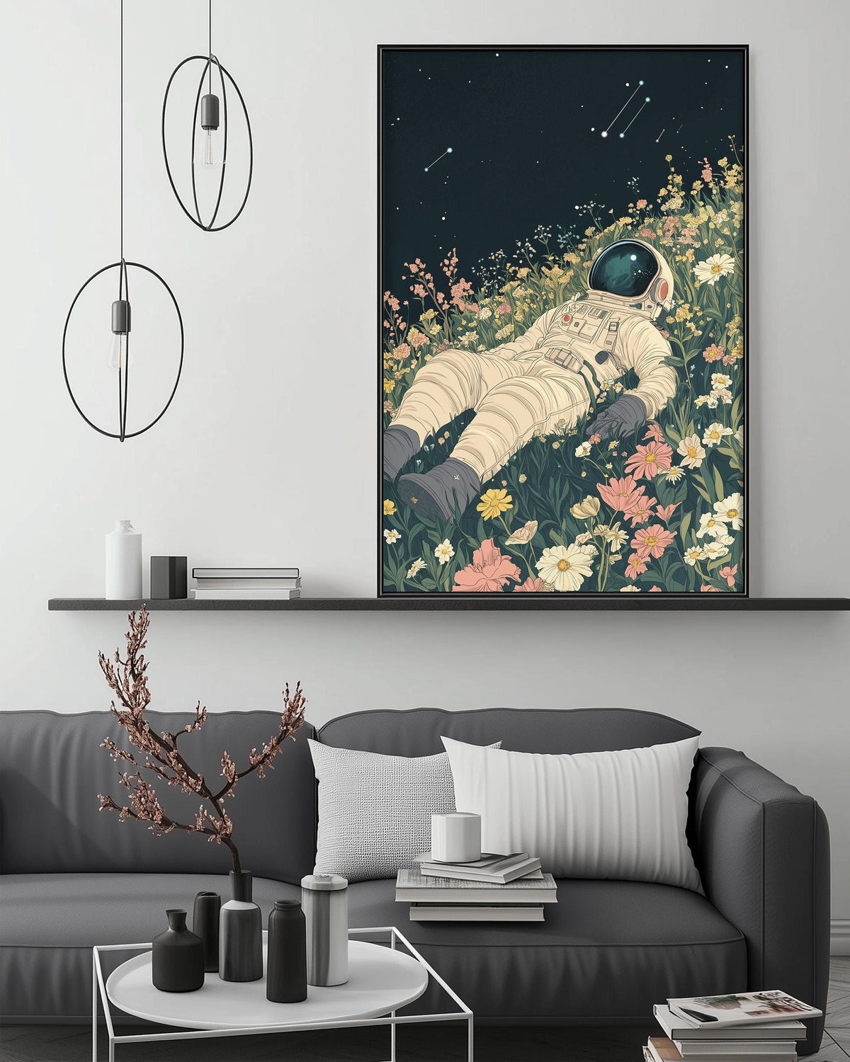 a large, colorful painting of an astronaut floating in a field of flowers, with a black background and a starry night sky. The painting is hanging on a wall above a gray couch, which has a coffee table in front of it. The room also has a shelf with various decorative items, and a potted plant on the floor.