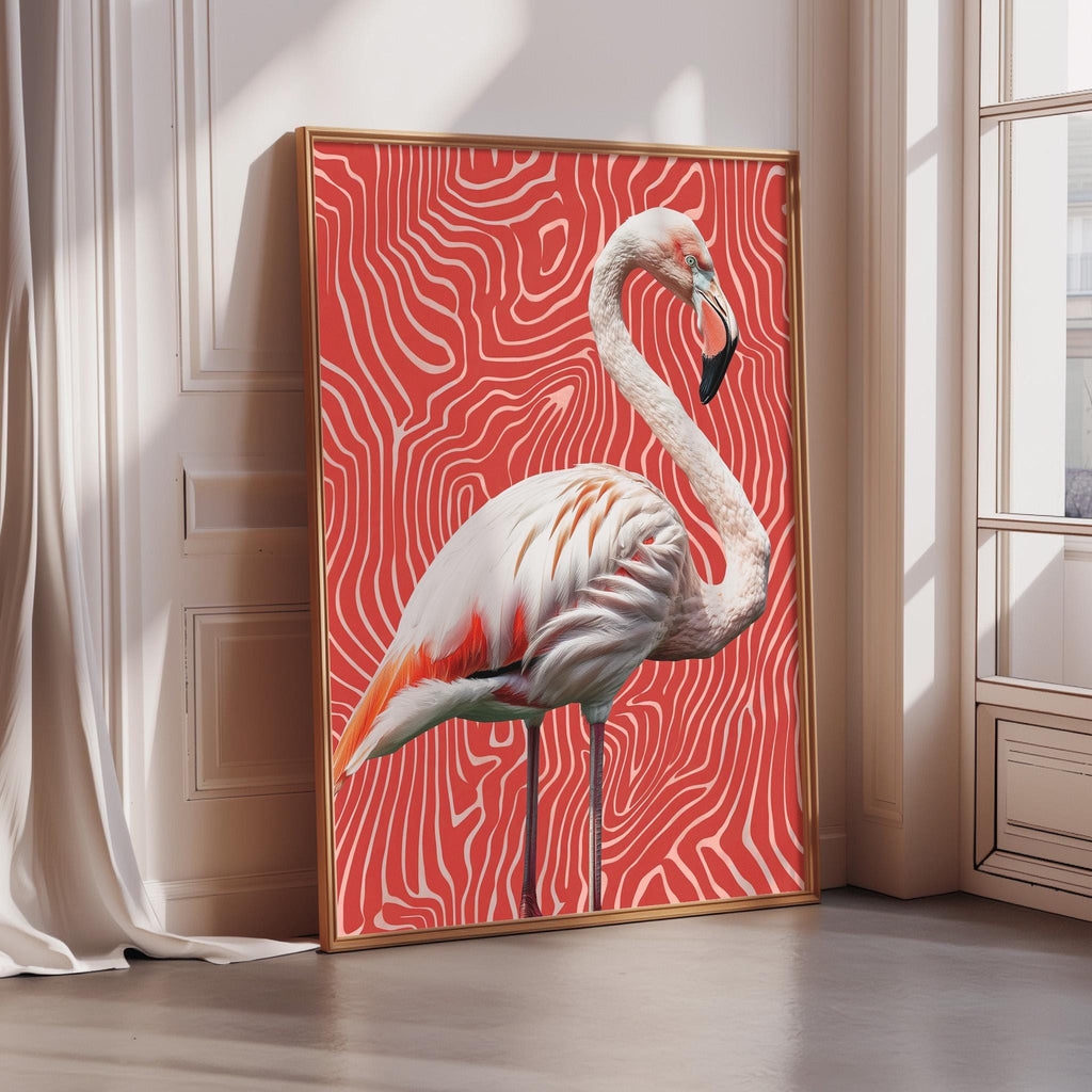 A framed photograph of a flamingo standing on a red and white zebra print background.