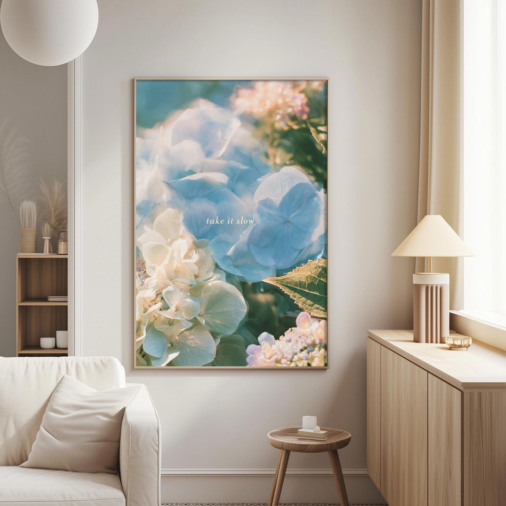 a large framed picture of flowers hanging on a wall in a living room.
