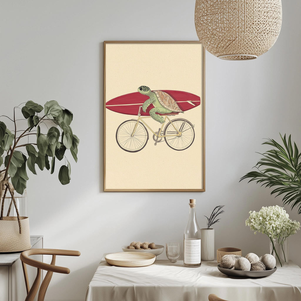 a framed illustration of a turtle riding a bicycle, with a surfboard attached to the back. The turtle is depicted in a playful and whimsical manner, adding a unique and interesting touch to the overall composition.