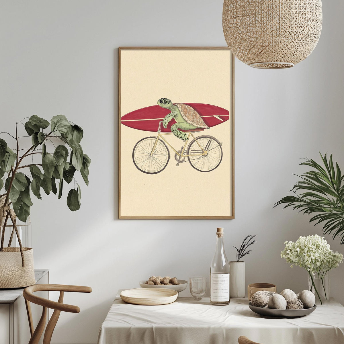 a framed illustration of a turtle riding a bicycle, with a surfboard attached to the back. The turtle is depicted in a playful and whimsical manner, adding a unique and interesting touch to the overall composition.