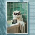 A white cat wearing sunglasses is sitting on a counter in a bathroom, with a sign that says "HOW TO KISS" in front of it.