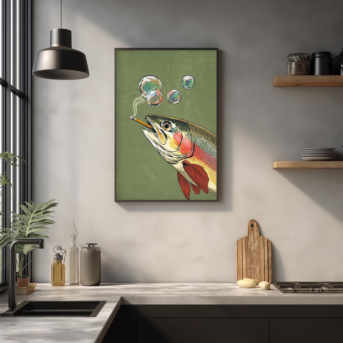 a kitchen counter with various items, including a framed picture of a fish blowing bubbles, a wooden cutting board, and a potted plant.