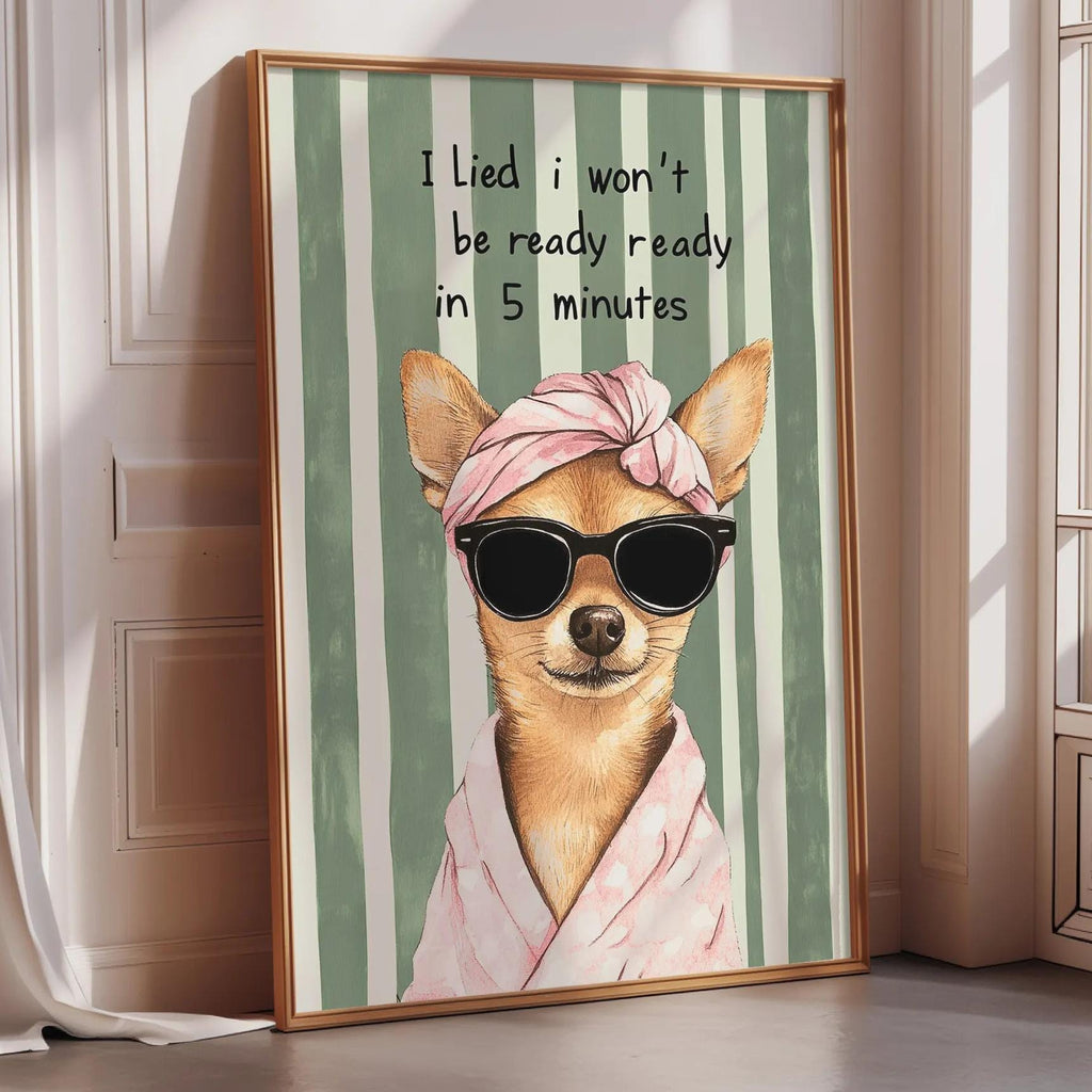 A framed poster of a dog wearing sunglasses and a pink headband, with the text "I Lied I won't be ready ready in 5 minutes" written above it.