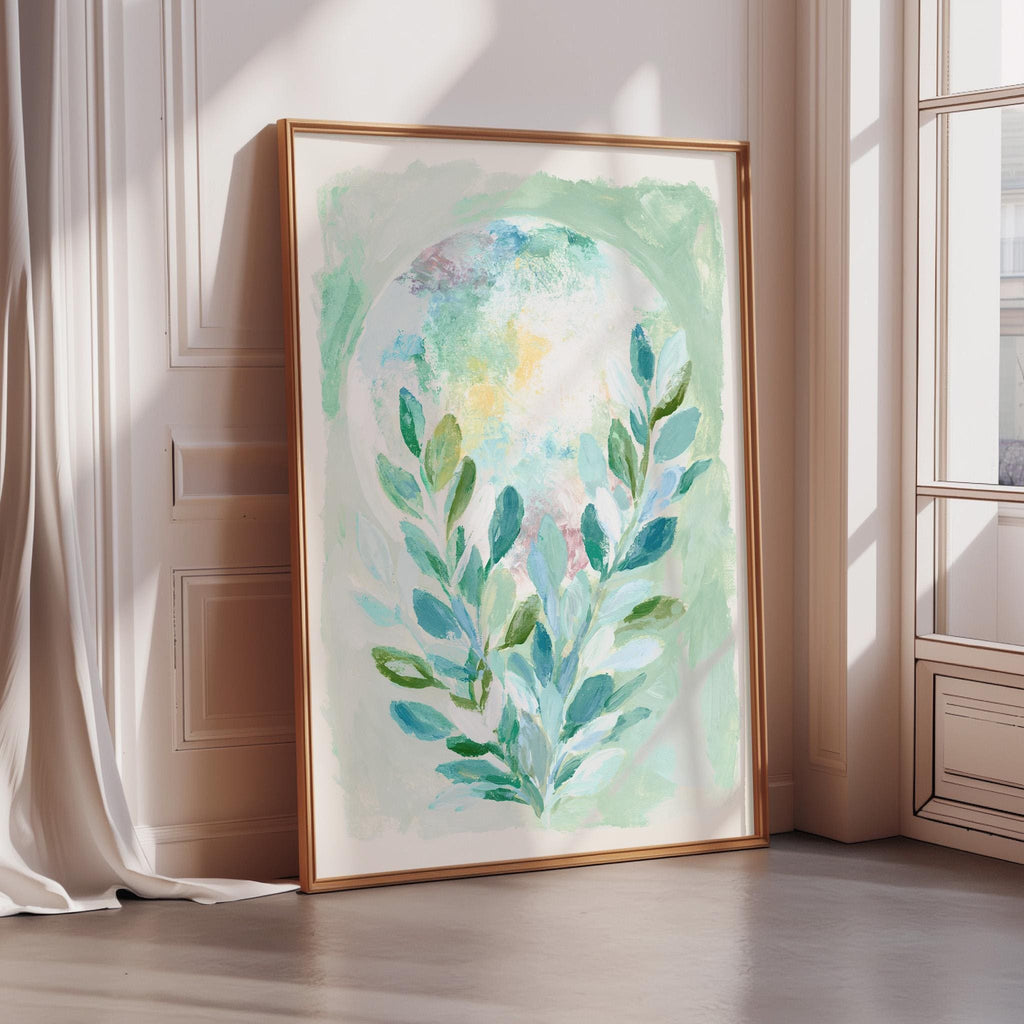 a large, framed painting of a plant with green leaves, displayed on a wall in a room with a window.