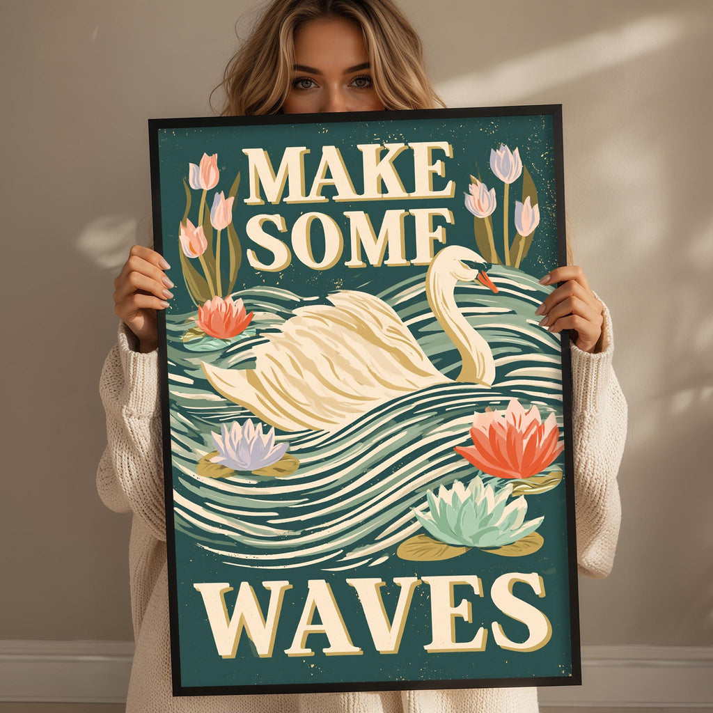 A woman is holding up a framed poster with a swan and flowers, and the text "MAKE SOME WAVE" is displayed on the poster.