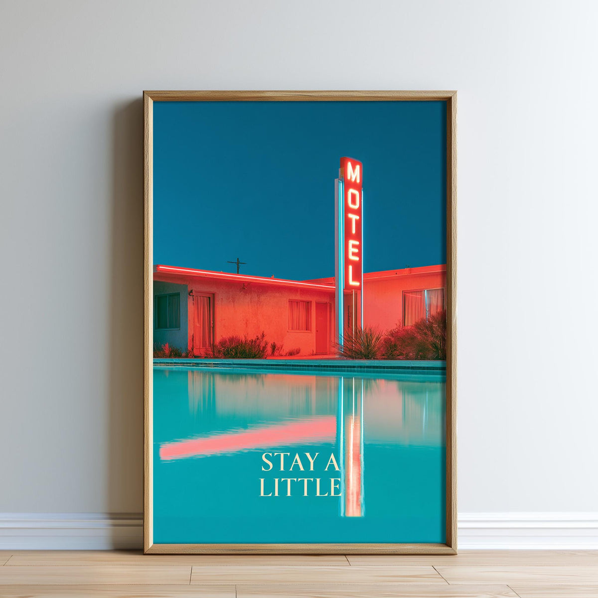A framed poster featuring a bright red motel sign against a blue sky, with a pool and a reflection in the water below.