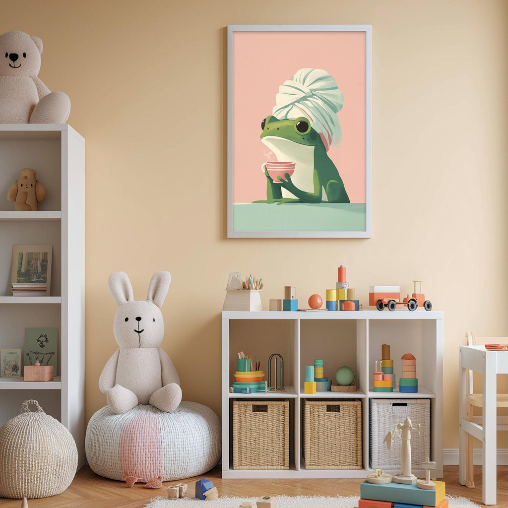A child's bedroom with a white bookshelf, a stuffed rabbit, a framed illustration of a frog wearing a towel, and a toy train set on a shelf.