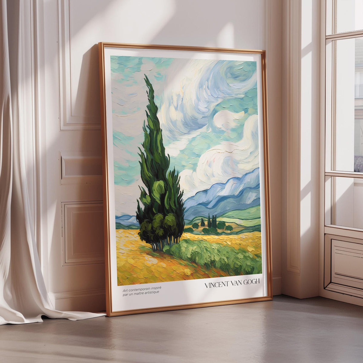 a large framed painting of a landscape with a tall tree in the foreground and a countryside scene in the background.