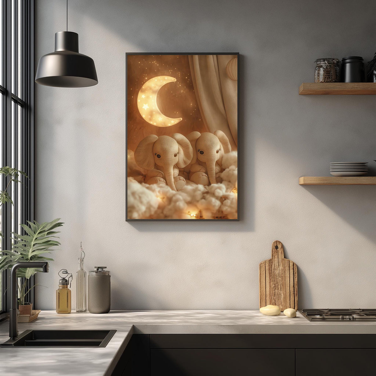 a framed artwork depicting two elephants sitting on clouds, with a crescent moon in the background. The artwork is hung on a wall above a kitchen counter, which has various kitchen items such as a cutting board, a bottle, and a bowl.