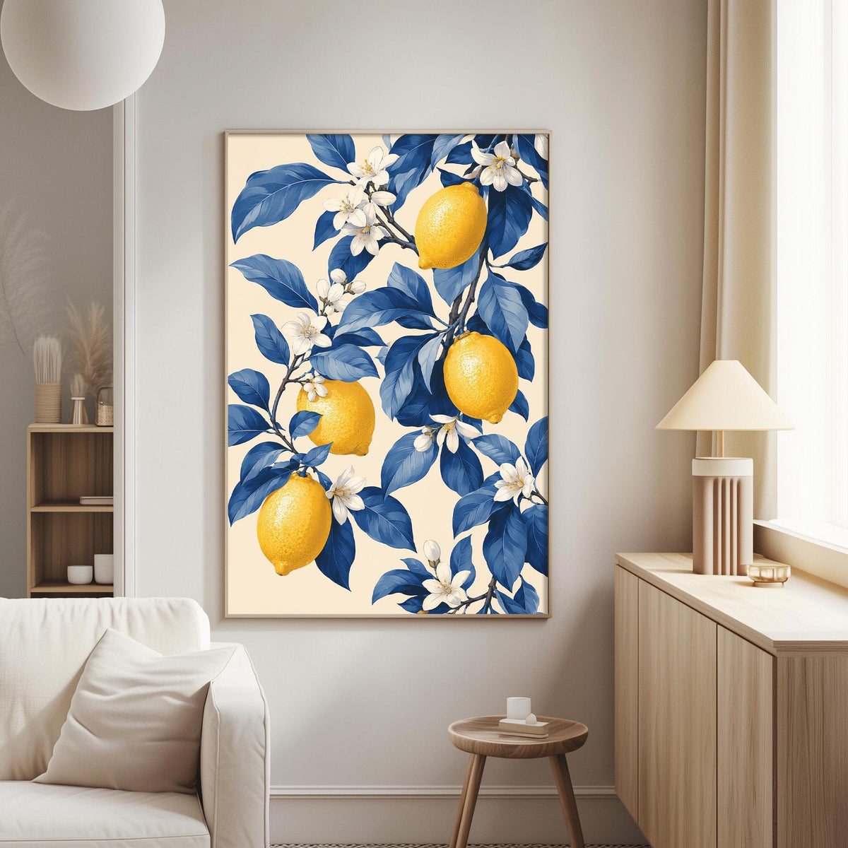 a living room with a large framed print of a lemon tree on the wall, which is the focal point of the room. The print has a blue and white color scheme and depicts a tree with yellow lemons and blue leaves. The room also includes a white sofa, a wooden side table, and a lamp, creating a cozy and inviting atmosphere.