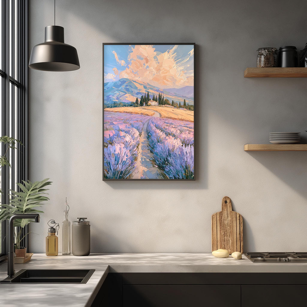 a kitchen counter with a framed painting of a field of lavender flowers hanging above it. The painting depicts a scenic landscape with a winding path leading through the field of purple flowers. The kitchen counter has various items on it, including a cutting board, a bottle, and a vase. The overall scene is a harmonious blend of nature and domestic life.