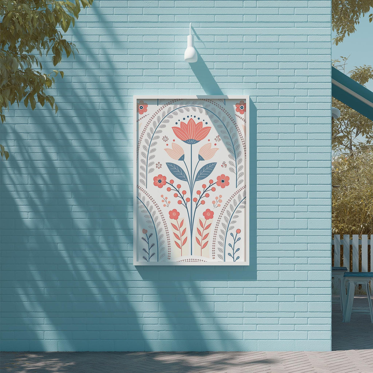 a blue brick wall with a framed artwork depicting a floral design in shades of pink, orange, and blue.