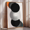 a large abstract art piece with a black and white color scheme, featuring concentric circles and a black background.