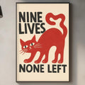 a kitchen counter with a framed poster of a red cat and the text "NINE LIVES NONE LEFT" hanging on the wall above it.