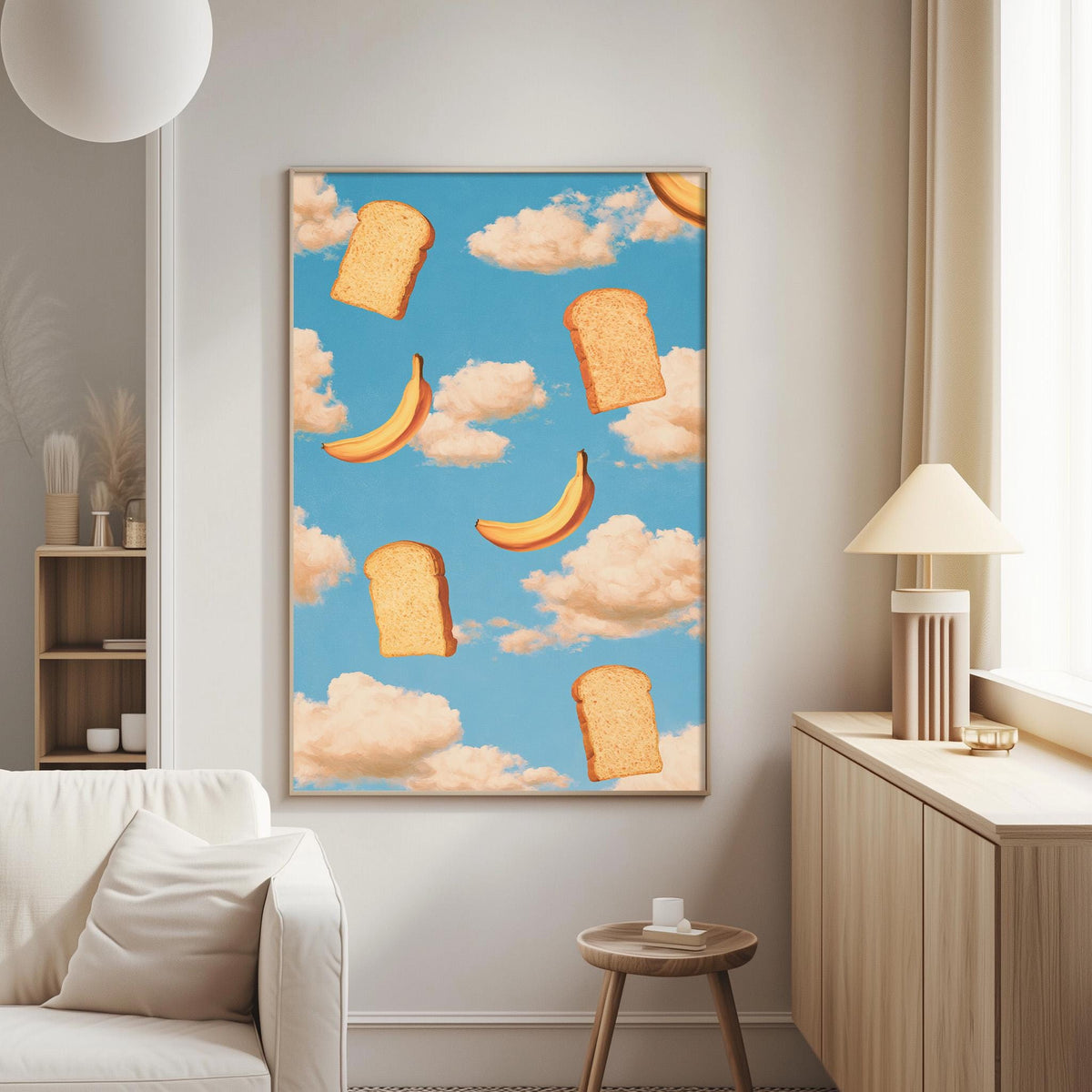 a large framed artwork depicting a whimsical scene of bread and bananas floating in a blue sky with fluffy clouds.