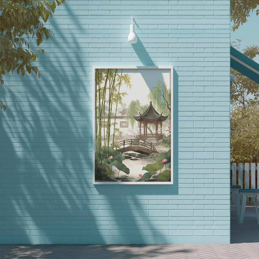 A framed painting of a serene garden scene with a traditional Chinese pavilion, bamboo trees, and a pond is displayed on a light blue brick wall.