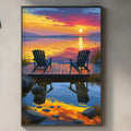 a serene scene of a sunset over a lake, with two chairs overlooking the water. The chairs are positioned on a wooden dock, and the sky is filled with vibrant colors reflecting on the water surface. The image is framed and hung on a wall, creating a peaceful and relaxing atmosphere in the room.