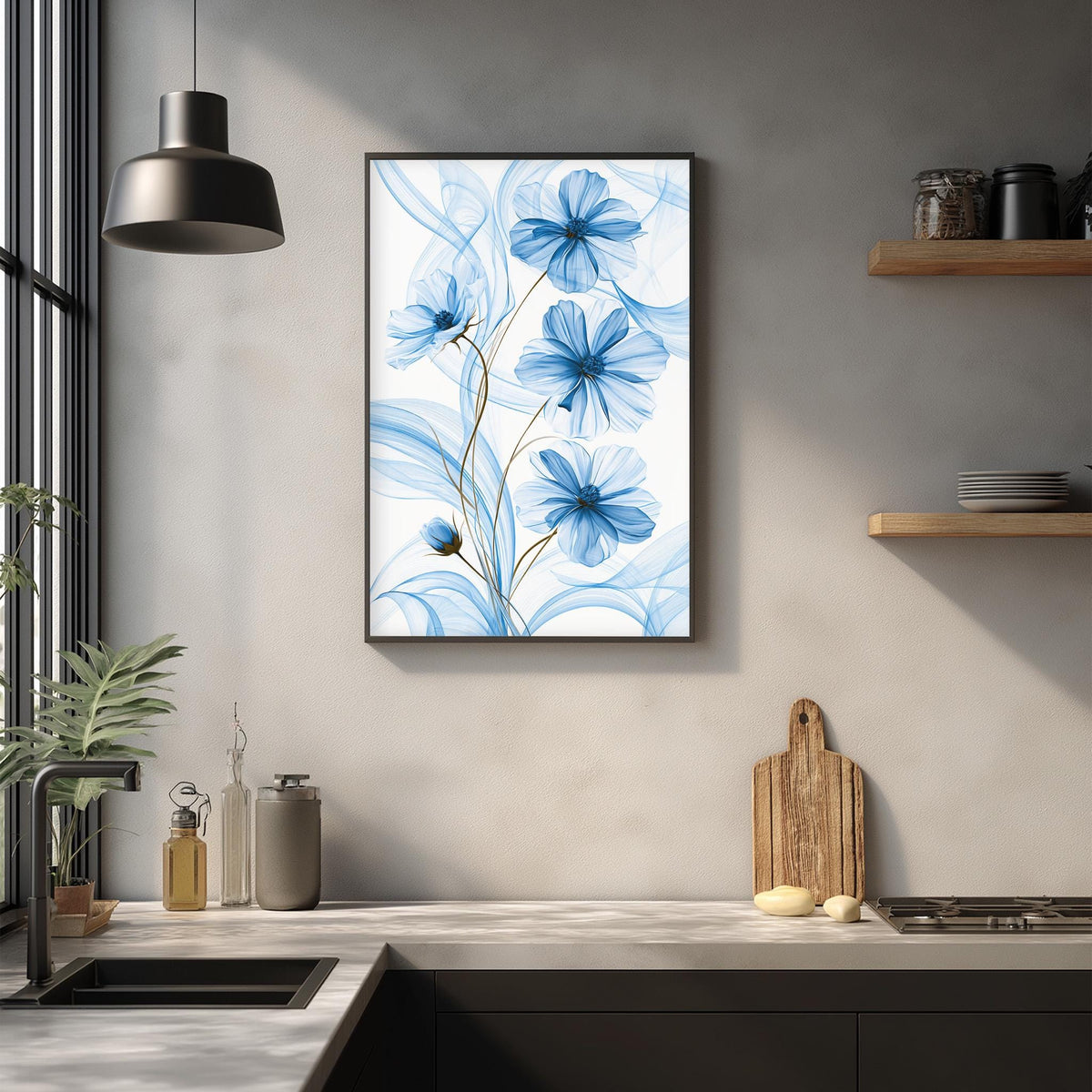 a kitchen counter with a framed picture of blue flowers hanging on the wall above it. The counter has various kitchen items, such as a cutting board, a bottle, and a bowl, as well as a potted plant.