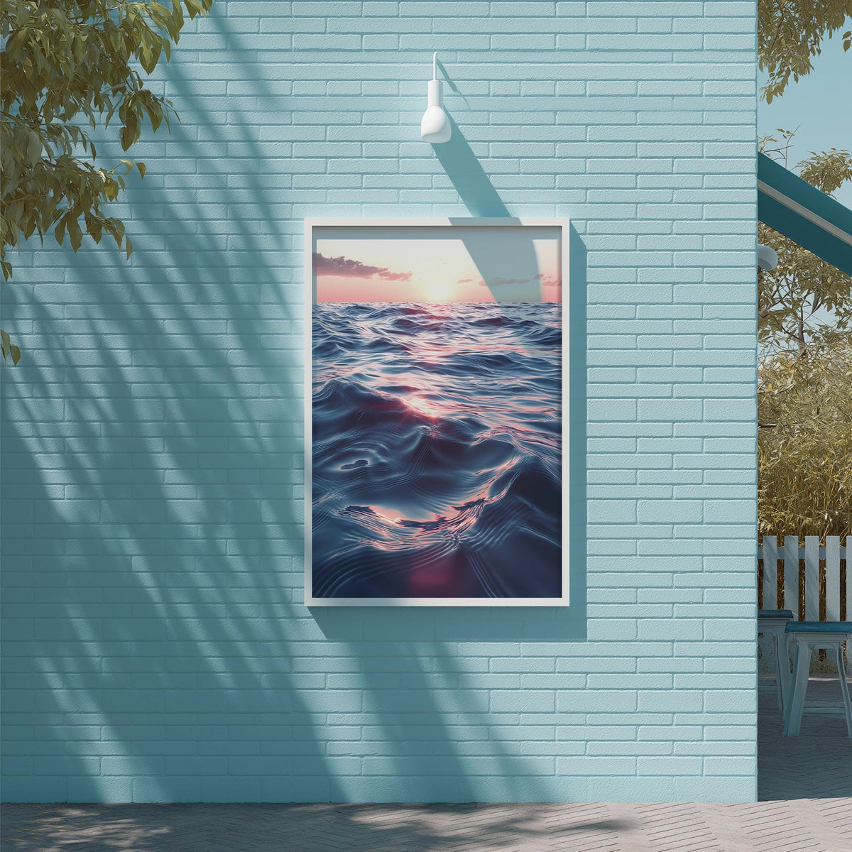 a large, framed picture of a seascape hanging on a light blue brick wall.