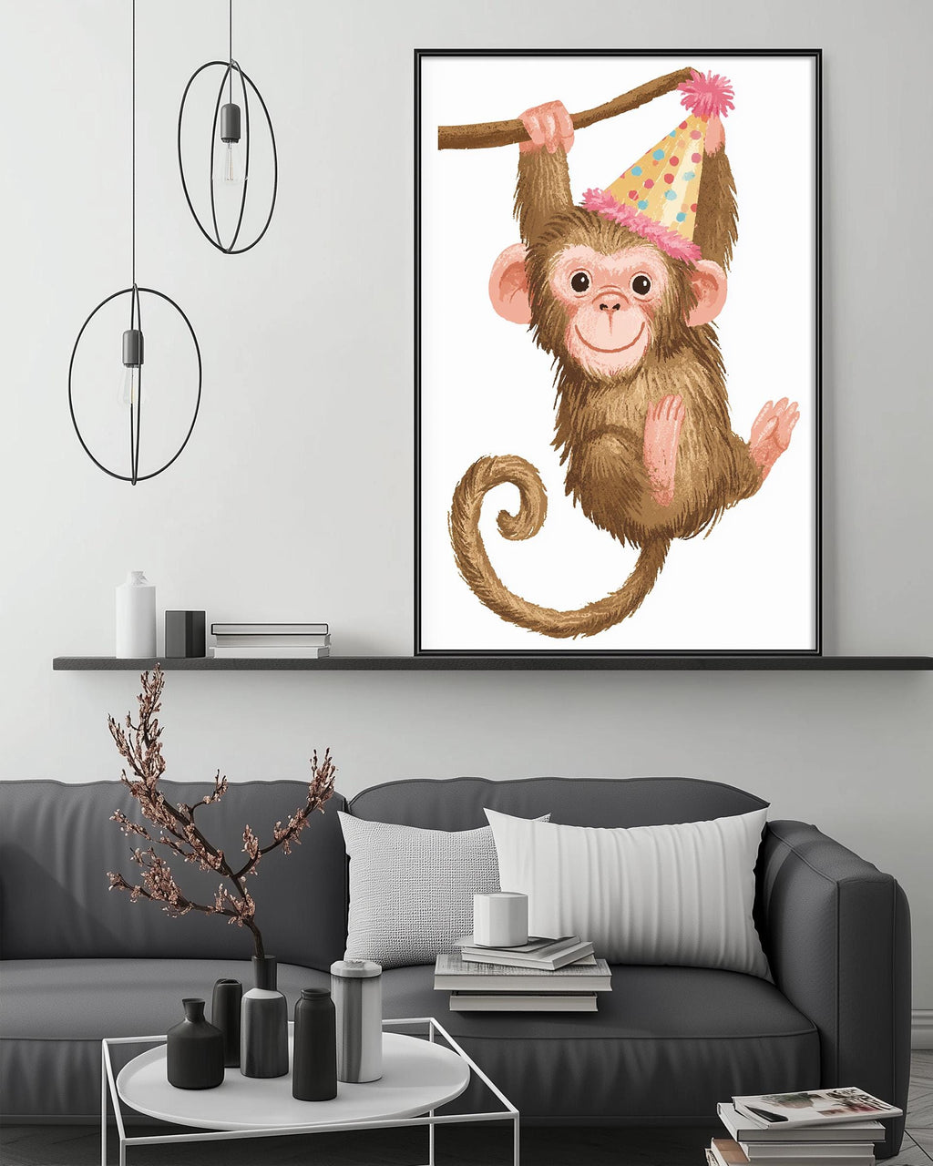 a cozy living room with a gray couch, a coffee table, and a framed illustration of a monkey wearing a party hat hanging on the wall above the couch.