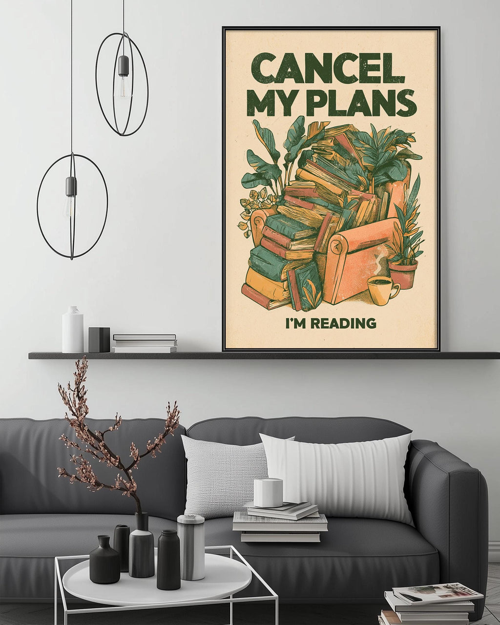 a cozy living room with a gray couch, a coffee table, and a framed poster on the wall that reads "CANCEL MY PLANES I'M READING".