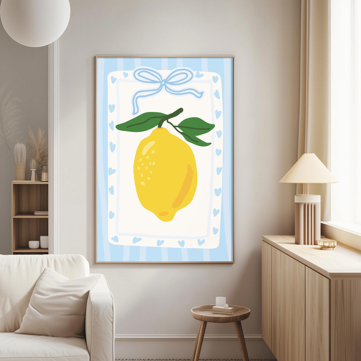 a living room with a white sofa, a wooden side table, and a framed picture of a lemon on the wall.