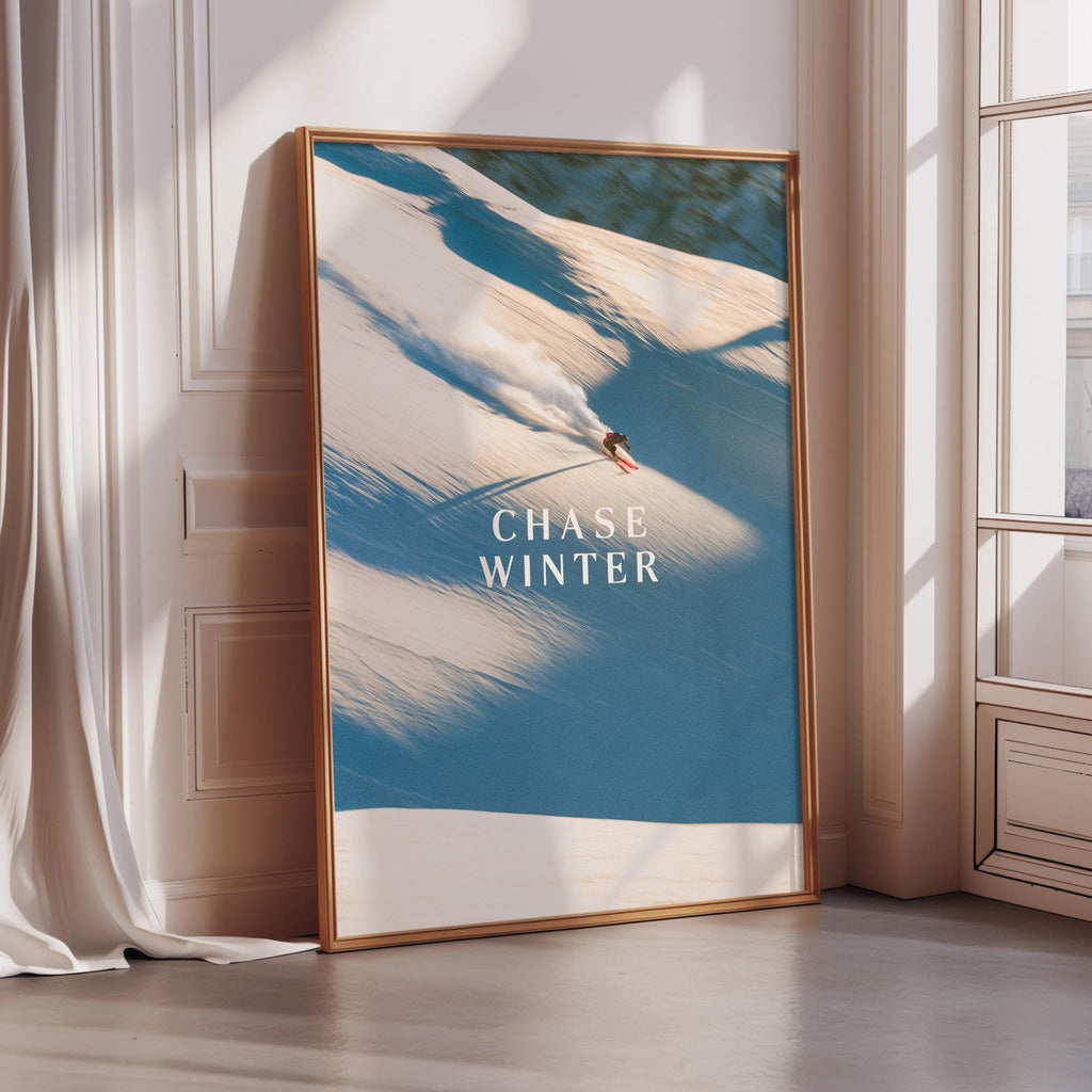 A framed poster with a snowboarding scene on it, featuring a person riding a snowboard down a snowy slope.