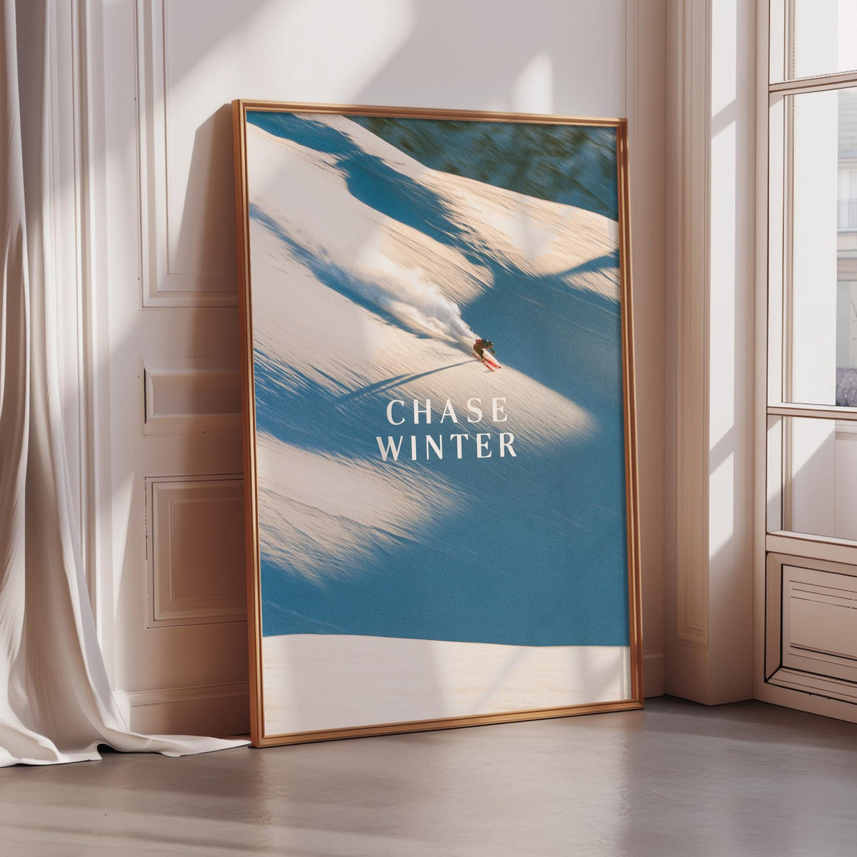 A framed poster with a snowboarding scene on it, featuring a person riding a snowboard down a snowy slope.