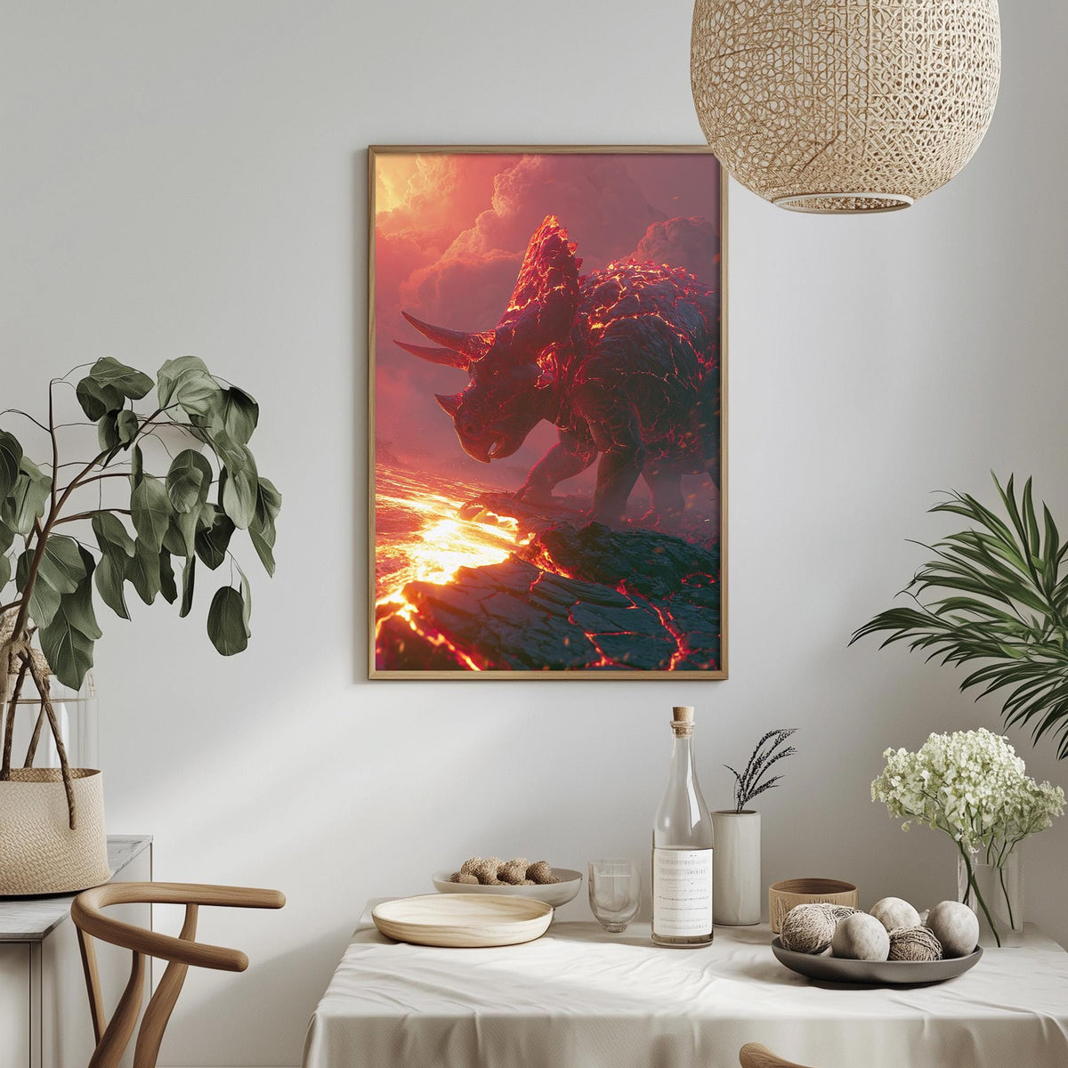 a framed artwork depicting a fiery dinosaur-like creature, possibly a triceratops, set against a backdrop of a fiery landscape. The artwork is hung on a wall above a dining table, which is adorned with various decorative items such as potted plants, vases, and bowls.