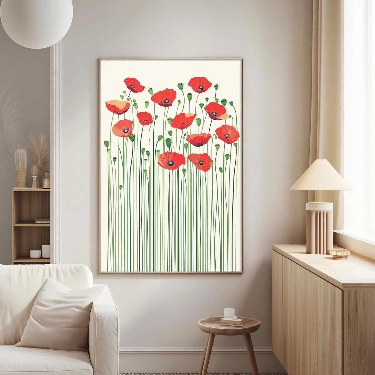 a living room with a large framed print of red flowers on the wall, a white sofa, a wooden side table, and a lamp.